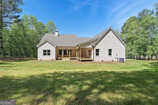 2000 Millstream Ct, Griffin, GA 30224 - rear view of house featuring a chimney, a yard, central AC, crawl space, and a wooden deck