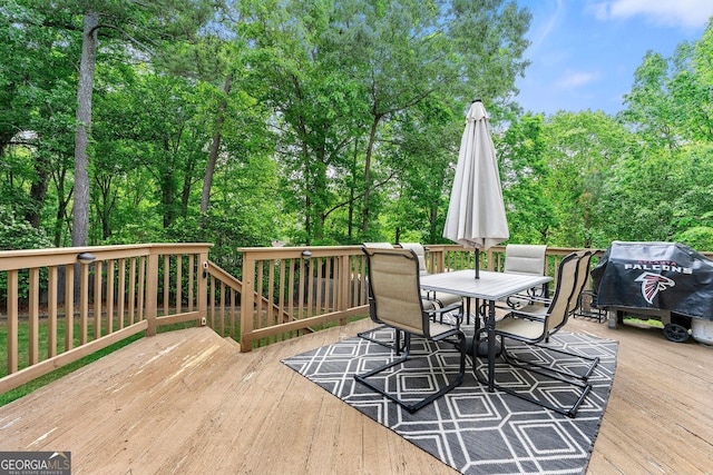 wooden deck with outdoor dining space