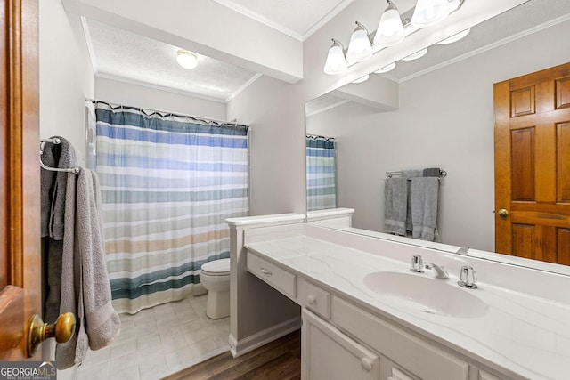 bathroom with a textured ceiling, curtained shower, vanity, toilet, and ornamental molding
