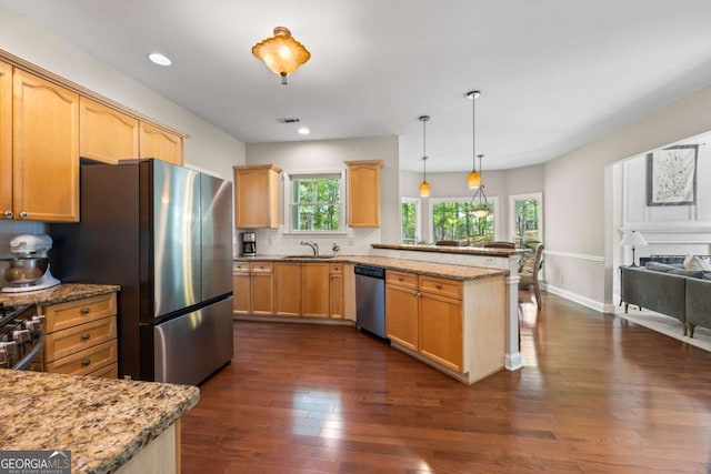 2745 Princeton Trce, Cumming, GA 30041 - kitchen featuring dark wood finished floors, light brown cabinets, a peninsula, and stainless steel appliances