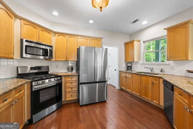 2745 Princeton Trce, Cumming, GA 30041 - kitchen with light stone counters, a sink, stainless steel appliances, dark wood finished floors, and visible vents