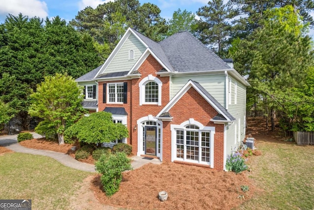 2745 Princeton Trce, Cumming, GA 30041 - colonial-style house with a shingled roof, brick siding, and a front yard