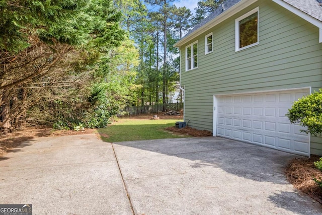 2745 Princeton Trce, Cumming, GA 30041 - view of property exterior featuring driveway, roof with shingles, a yard, and a garage
