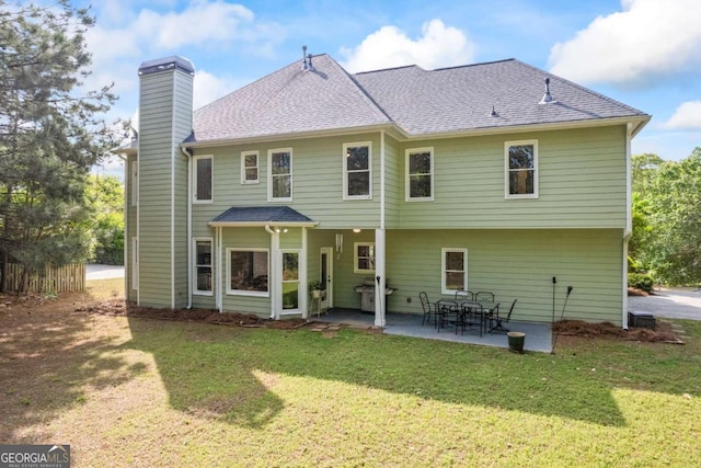 2745 Princeton Trce, Cumming, GA 30041 - rear view of property featuring a lawn, a patio, a chimney, and a shingled roof