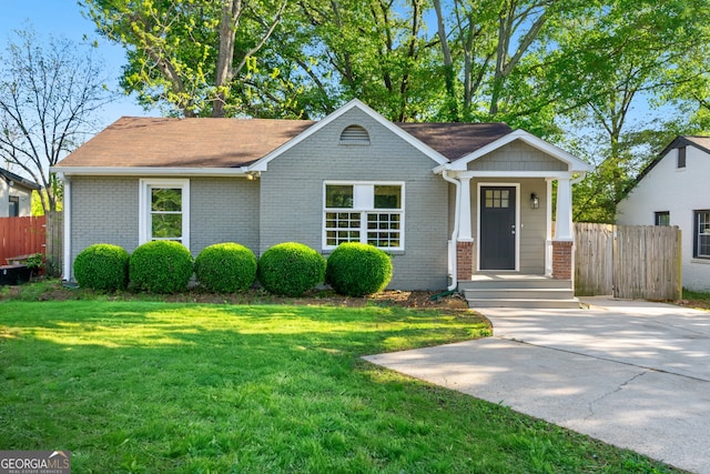 1258 Lyle Ave, East Point, GA 30344 - view of front facade with brick siding, fence, and a front yard