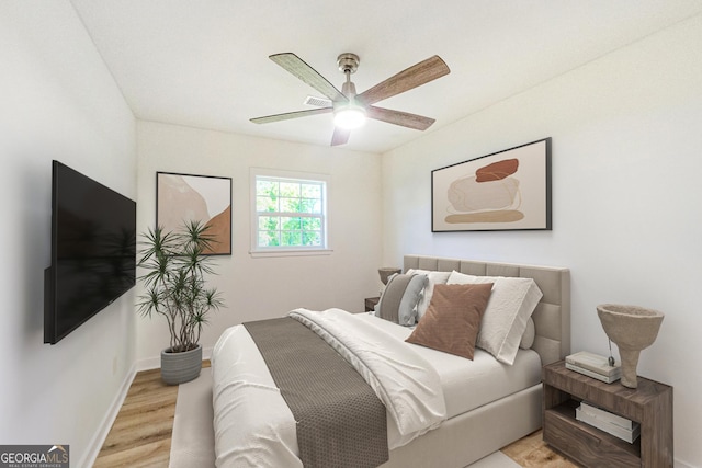 1258 Lyle Ave, East Point, GA 30344 - bedroom with a ceiling fan, baseboards, and light wood-style floors