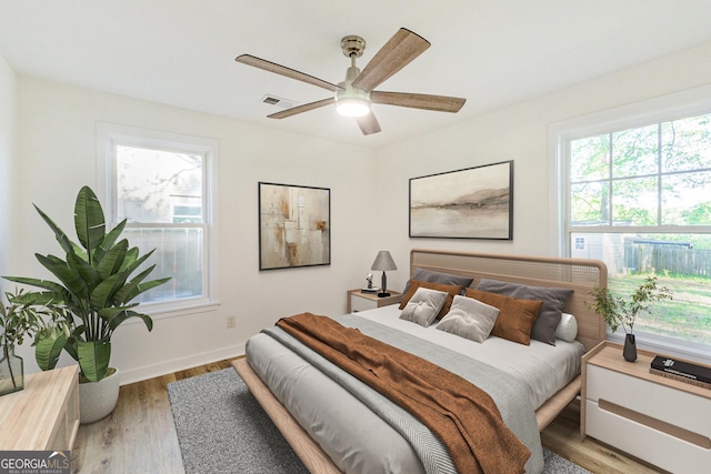 1258 Lyle Ave, East Point, GA 30344 - bedroom featuring a ceiling fan, baseboards, visible vents, and wood finished floors
