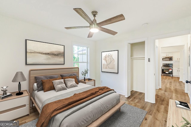 1258 Lyle Ave, East Point, GA 30344 - bedroom featuring a ceiling fan, baseboards, light wood finished floors, and a closet