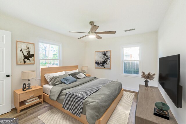 1258 Lyle Ave, East Point, GA 30344 - bedroom featuring visible vents, a ceiling fan, and wood finished floors