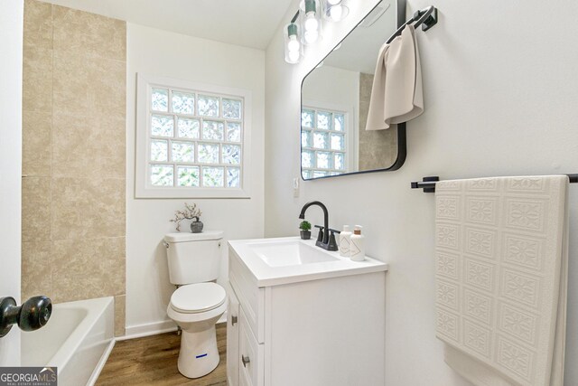 1258 Lyle Ave, East Point, GA 30344 - full bath featuring vanity, wood finished floors, and toilet
