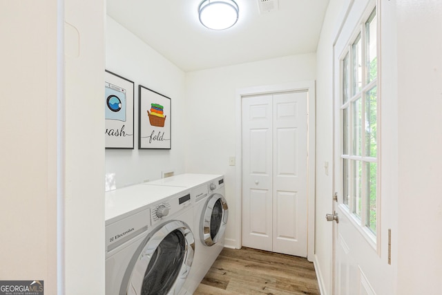 1258 Lyle Ave, East Point, GA 30344 - laundry area with plenty of natural light, laundry area, light wood-type flooring, and independent washer and dryer