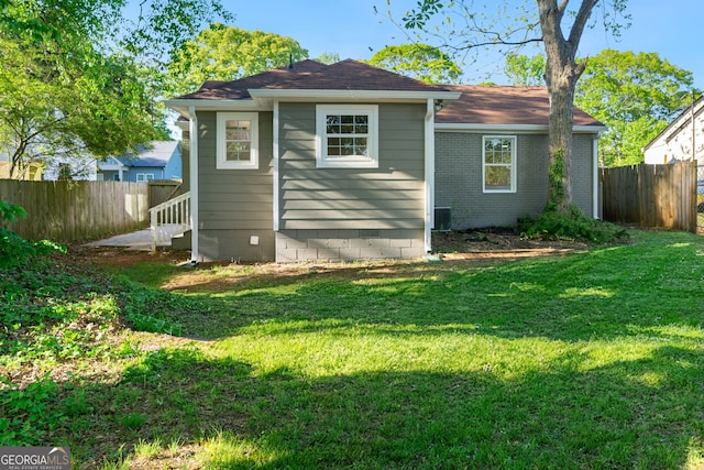 1258 Lyle Ave, East Point, GA 30344 - back of house featuring fence, a yard, and crawl space