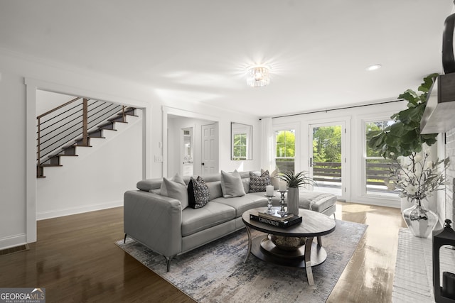 4440 Webb Bridge Rd, Alpharetta, GA 30005 - living area with stairway, baseboards, wood finished floors, and recessed lighting