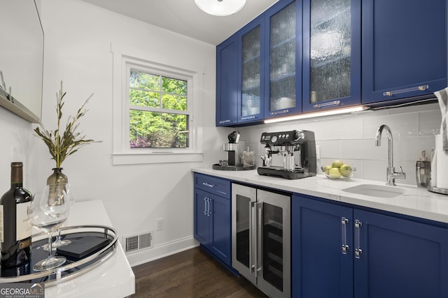4440 Webb Bridge Rd, Alpharetta, GA 30005 - indoor bar featuring beverage cooler, baseboards, dark wood-style flooring, and decorative backsplash