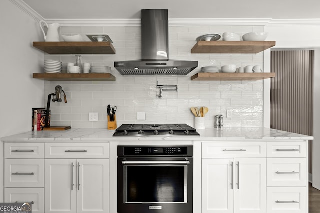 4440 Webb Bridge Rd, Alpharetta, GA 30005 - kitchen with oven, wall chimney range hood, open shelves, stainless steel gas cooktop, and crown molding