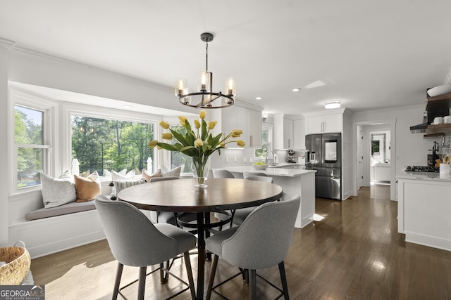 4440 Webb Bridge Rd, Alpharetta, GA 30005 - dining space featuring a chandelier, ornamental molding, dark wood-style flooring, and recessed lighting