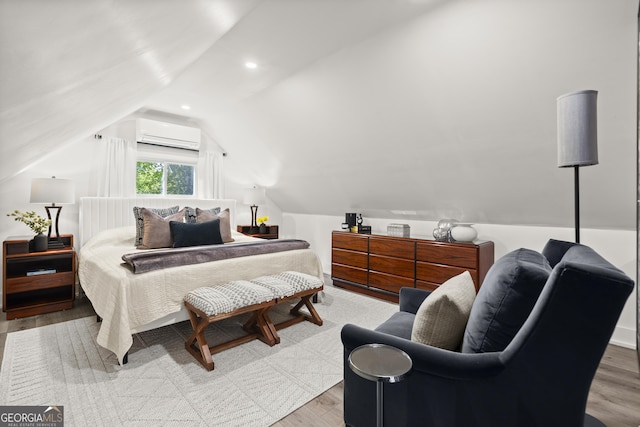 4440 Webb Bridge Rd, Alpharetta, GA 30005 - bedroom with lofted ceiling, an AC wall unit, wood finished floors, and recessed lighting