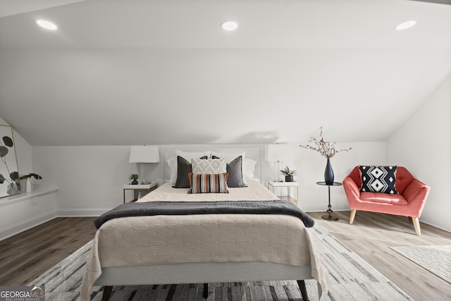 4440 Webb Bridge Rd, Alpharetta, GA 30005 - bedroom featuring wood finished floors, baseboards, recessed lighting, and lofted ceiling