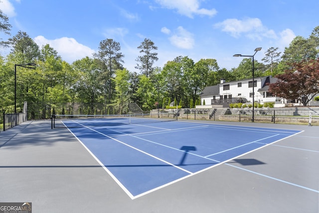 4440 Webb Bridge Rd, Alpharetta, GA 30005 - view of tennis court with community basketball court and view of scattered trees