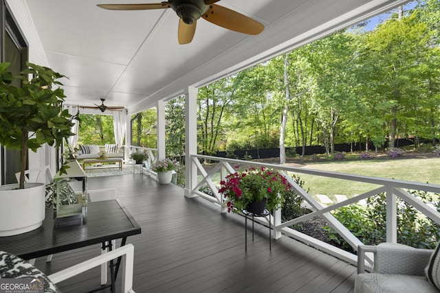 4440 Webb Bridge Rd, Alpharetta, GA 30005 - wooden porch featuring a ceiling fan and view of scattered trees
