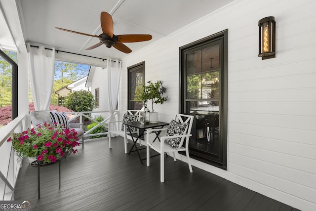 4440 Webb Bridge Rd, Alpharetta, GA 30005 - sunroom / solarium featuring a ceiling fan, wood finished floors, and wood walls