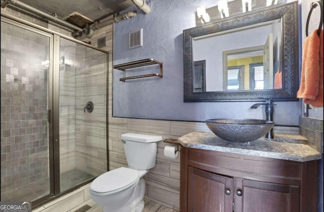 375 Ralph Mcgill Blvd # 1503, Atlanta, GA 30312 - full bath with vanity, a shower stall, and tile walls
