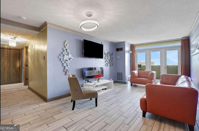 375 Ralph Mcgill Blvd # 1503, Atlanta, GA 30312 - living area with ornamental molding, a textured ceiling, and light wood finished floors