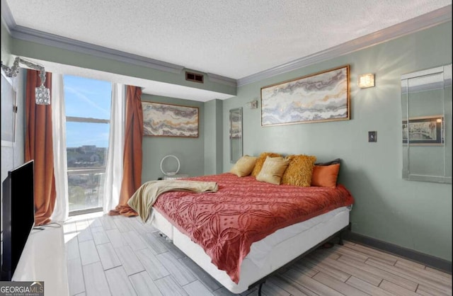 375 Ralph Mcgill Blvd # 1503, Atlanta, GA 30312 - bedroom featuring ornamental molding, a textured ceiling, and light wood-style flooring