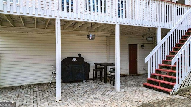 view of patio / terrace featuring grilling area and stairs