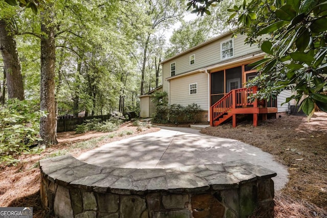 90 Hart Ave, Athens, GA 30606 - rear view of house with a sunroom and a patio area