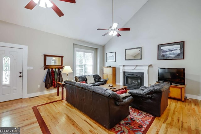 90 Hart Ave, Athens, GA 30606 - living area featuring a ceiling fan, light wood-style floors, a glass covered fireplace, and high vaulted ceiling