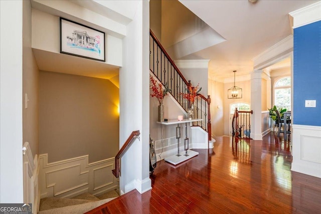 2145 Shoop Ct SE Unit 3, Smyrna, GA 30080 - stairway featuring a decorative wall, hardwood / wood-style floors, crown molding, and wainscoting