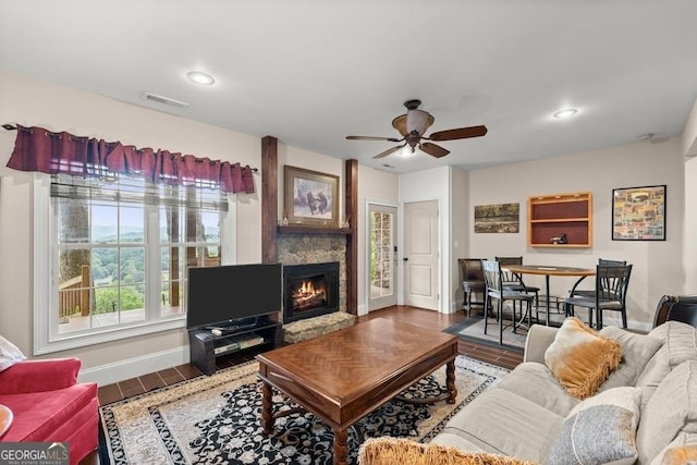 1609 Clark Dr, Hiawassee, GA 30546 - living area with visible vents, baseboards, wood finished floors, ceiling fan, and a fireplace