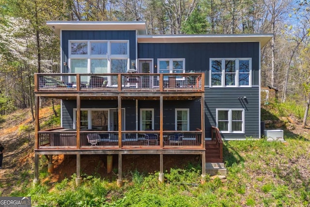 124 Nichols Branch Ln, Clayton, GA 30525 - rear view of house with a deck and board and batten siding