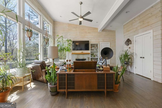 124 Nichols Branch Ln, Clayton, GA 30525 - living room with wooden walls, wood finished floors, ceiling fan, a fireplace, and high vaulted ceiling