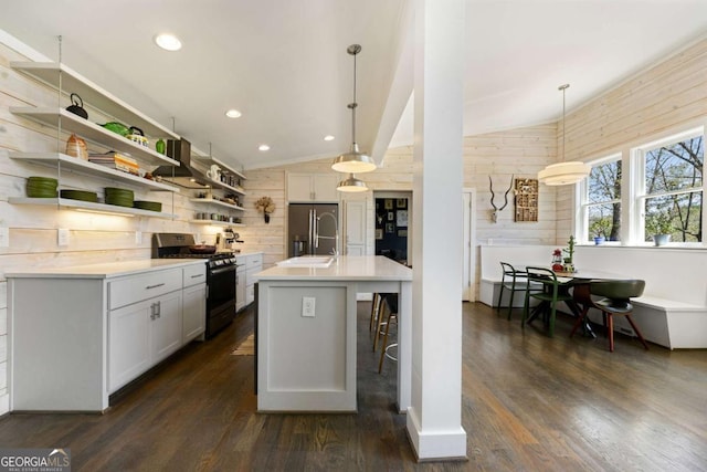 124 Nichols Branch Ln, Clayton, GA 30525 - kitchen featuring gas stove, refrigerator with ice dispenser, lofted ceiling, open shelves, and dark wood-style flooring