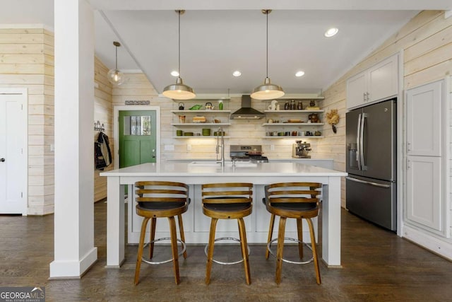 124 Nichols Branch Ln, Clayton, GA 30525 - kitchen with appliances with stainless steel finishes, open shelves, wall chimney exhaust hood, wood walls, and light countertops