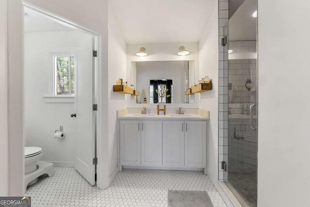 124 Nichols Branch Ln, Clayton, GA 30525 - bathroom featuring double vanity, a stall shower, and tile patterned floors