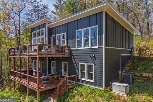 124 Nichols Branch Ln, Clayton, GA 30525 - back of house with board and batten siding and a wooden deck