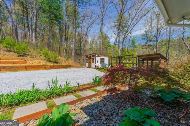 124 Nichols Branch Ln, Clayton, GA 30525 - view of yard with a shed