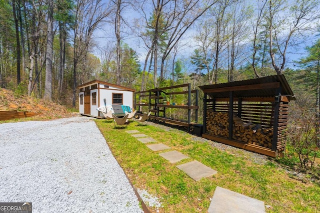 124 Nichols Branch Ln, Clayton, GA 30525 - view of yard with an outbuilding