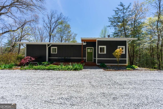 124 Nichols Branch Ln, Clayton, GA 30525 - view of front of home with board and batten siding and a sunroom