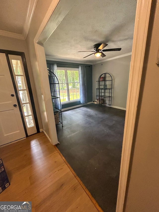15 Laurelwood Cir, Griffin, GA 30224 - entrance foyer featuring baseboards, ornamental molding, a textured ceiling, a ceiling fan, and wood finished floors