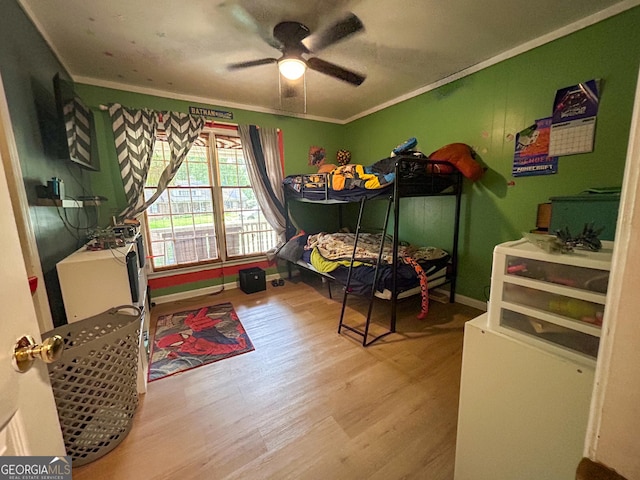15 Laurelwood Cir, Griffin, GA 30224 - bedroom with wood finished floors, ornamental molding, ceiling fan, and baseboards