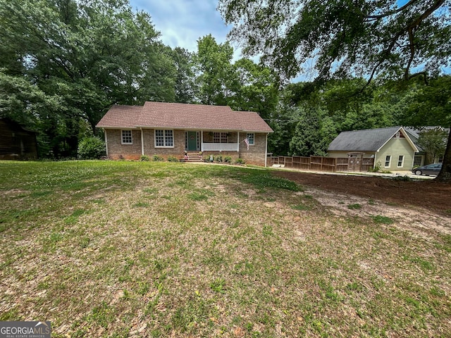 15 Laurelwood Cir, Griffin, GA 30224 - ranch-style house with a porch and brick siding