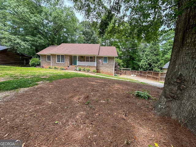 15 Laurelwood Cir, Griffin, GA 30224 - ranch-style home featuring a porch and brick siding