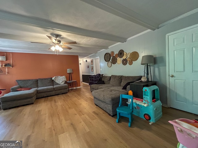 15 Laurelwood Cir, Griffin, GA 30224 - living area featuring wood finished floors, beam ceiling, a ceiling fan, and crown molding