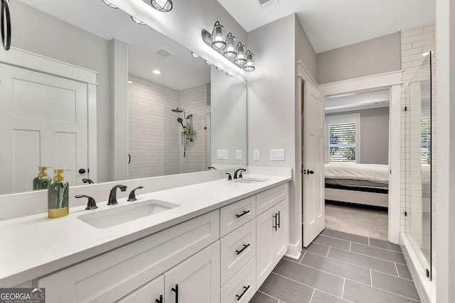 2710 Sandy Irwin Ct SW, Marietta, GA 30064 - bathroom with visible vents, a sink, double vanity, and a stall shower
