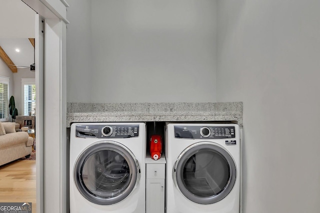 2710 Sandy Irwin Ct SW, Marietta, GA 30064 - laundry room with recessed lighting, wood finished floors, laundry area, and washer and clothes dryer