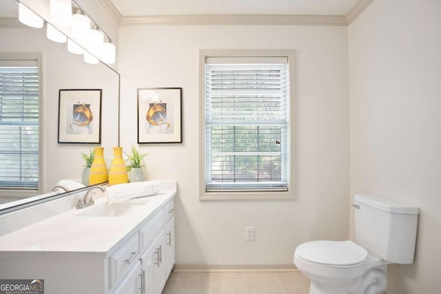 bathroom featuring crown molding, tile patterned floors, vanity, baseboards, and toilet